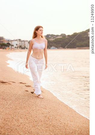 Young woman walking Young woman walking 11249950