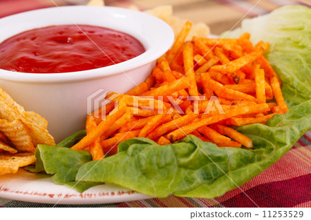 Potato chips and red sauce Potato chips and red sauce 11253529