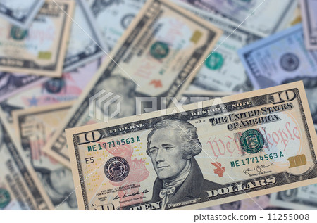 Ten-dollar bills and a lot of US dollar cash 11255008