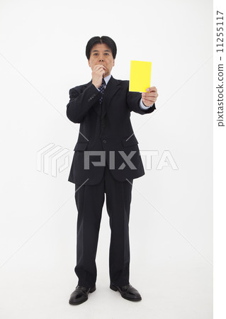 A man issuing a yellow card A man issuing a yellow card 11255117
