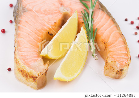 Fried salmon fillet on plate with lemon. 11264885