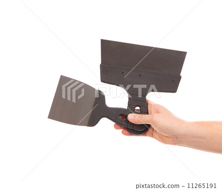 Two metal spatulas in hand 11265191
