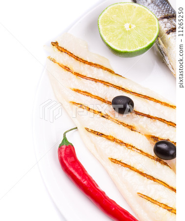 Fragmnt of the fish dish. Pangasius and sea bass. Fragmnt of the fish dish. Pangasius and sea bass. 11265250