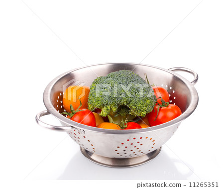 Vegetables in colander. 11265351