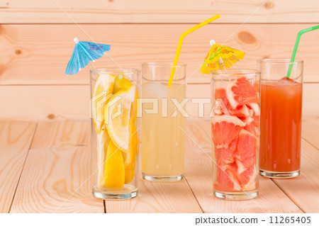 Lemonade and grapefruit juice on table. 11265405