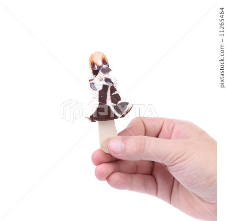 Bitten ice cream on stick. 11265464