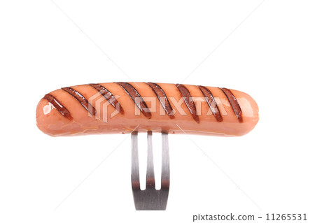 Grilled sausage on a fork. Grilled sausage on a fork. 11265531