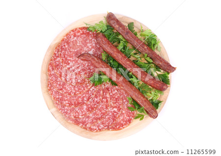 Composition of sausages on wooden platter. 11265599