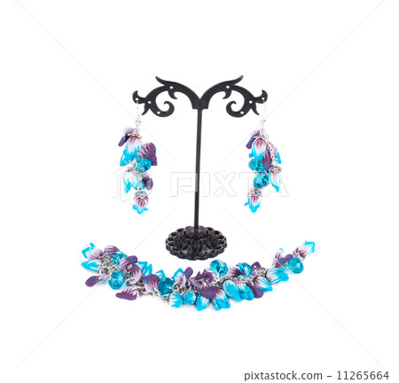 Bracelet and earrings on a stand. 11265664