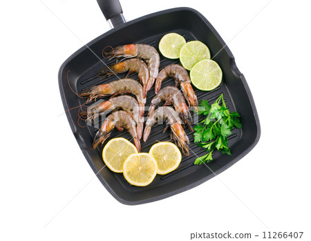 Raw shrimps on frying pan. Raw shrimps on frying pan. 11266407