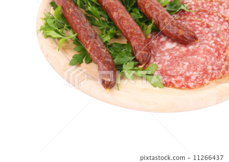 Composition of sausages on wooden platter. 11266437