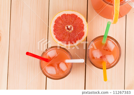 Grapefruit juice on table. 11267383