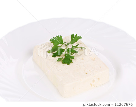 Tasty feta cheese on plate with herb. Tasty feta cheese on plate with herb. 11267676