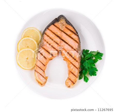 Fried salmon fillet on plate with lemon. 11267695