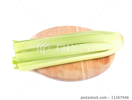 Fresh celery on wooden platter. 11267946