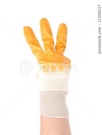 Gloved hand showing three fingers. Gloved hand showing three fingers. 11268317