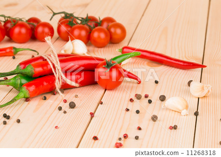 Hot chili pepper on wooden texture. Hot chili pepper on wooden texture. 11268318