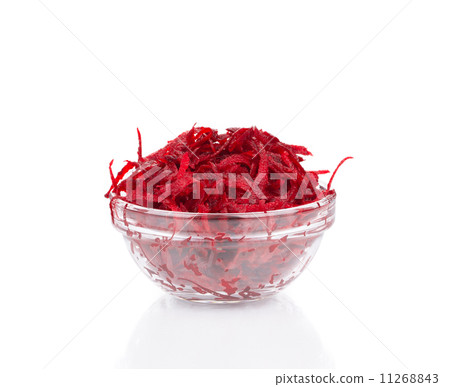 Glass bowl full with grated beets. 11268843