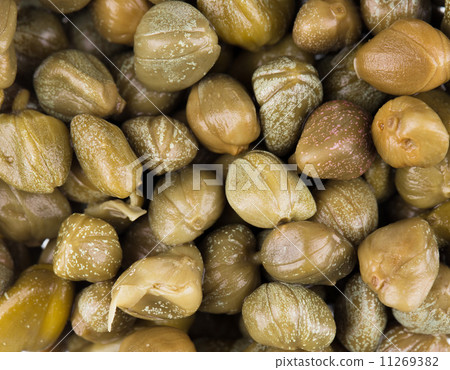 Green and appetizing capers. Green and appetizing capers. 11269382