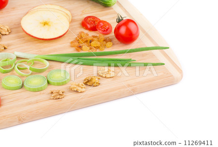 Vegetables on wooden platter. Vegetables on wooden platter. 11269411