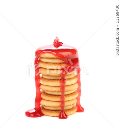 Stack of cookie biscuits in strawberry sauce. 11269430