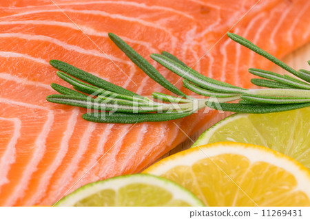 Closeup of salmon steak with rosemary. 11269431