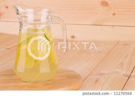 Glass pitcher full of fresh cold tasty lemonade. Glass pitcher full of fresh cold tasty lemonade. 11270568