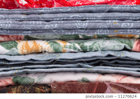 Stack of color clothes stored in rows. Stack of color clothes stored in rows. 11270624