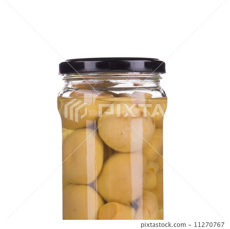 Marinated mushrooms in glass jar. Marinated mushrooms in glass jar. 11270767