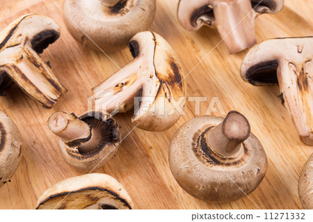 White mushrooms on wooden board. White mushrooms on wooden board. 11271332