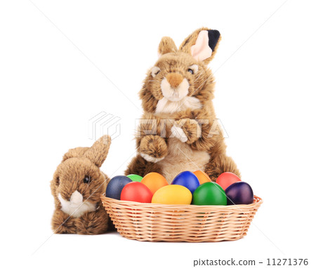 Fluffy foxy rabbit in basket with Easter eggs. Fluffy foxy rabbit in basket with Easter eggs. 11271376