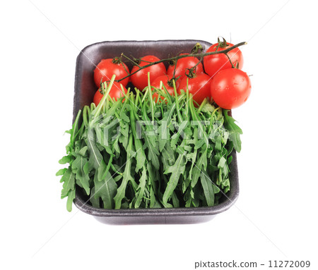 Fresh arugula and juicy tomatoes. Fresh arugula and juicy tomatoes. 11272009