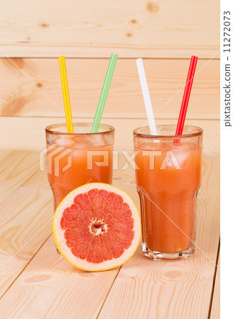 Grapefruit juice on table. Grapefruit juice on table. 11272073