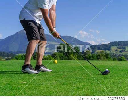 Golfer swinging driver Golfer swinging driver 11272830