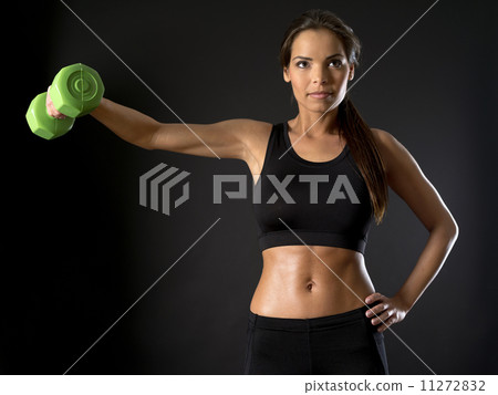 Female doing side shoulder fly Female doing side shoulder fly 11272832