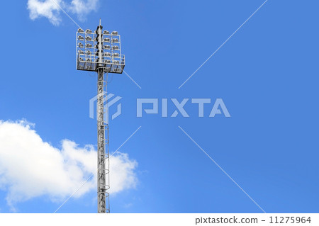 Stadium lights on a sports field and blue sky 11275964