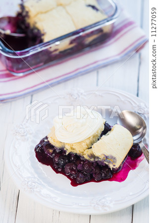 Closeup of a fresh blueberry cobbler. 11277059