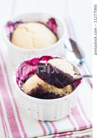 Closeup of a fresh blueberry cobbler. Closeup of a fresh blueberry cobbler. 11277060