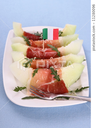 Ripe melon slice with ham, parmesan and Italy flag 11280096