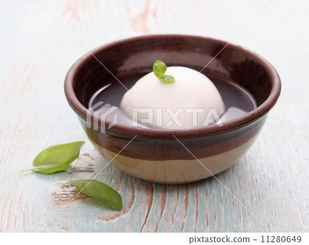 Mozzarella cheese in brine and basil leaf Mozzarella cheese in brine and basil leaf 11280649