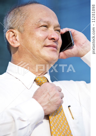Senior business executive talking on smart phone 11281898