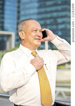 Senior business executive talking on smart phone Senior business executive talking on smart phone 11281899