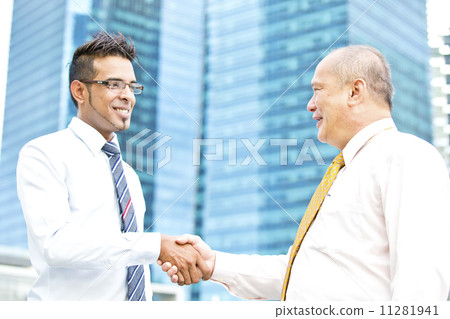 Multi-racial business executive handshake Multi-racial business executive handshake 11281941