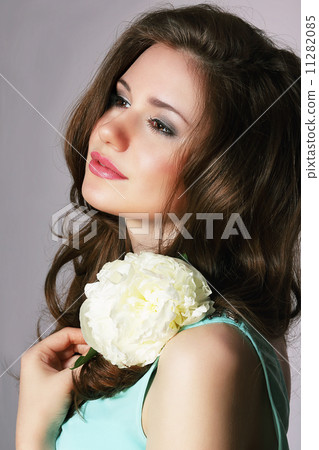 Femininity. Sincere Brunette with White Peony 11282085