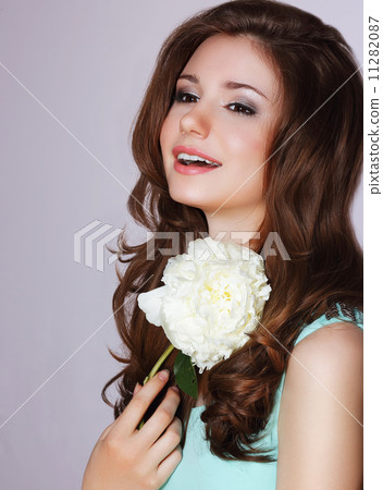 Freshness. Happy Woman with Peony Flower Smiling 11282087