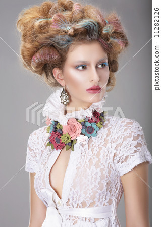 Elegant Charismatic Woman with Fancy Hairstyle 11282126