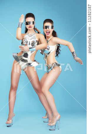 Night Life. Two Glamorous Women Dancers in Fantastic Masks 11282187