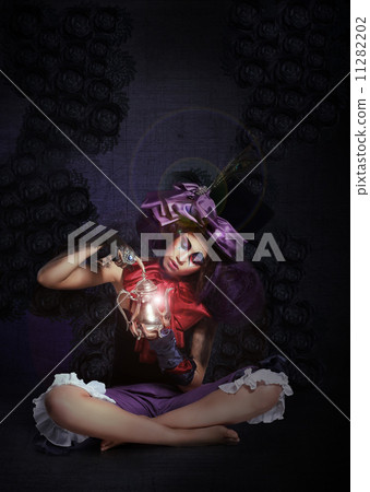 Witchcraft. Fairytale. Enigmatic Magus with Lamp in Darkness Witchcraft. Fairytale. Enigmatic Magus with Lamp in Darkness 11282202