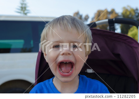 Happy little boy with his mouth open 11282205