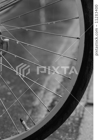 Bicycle wheels on a rainy day 11283400